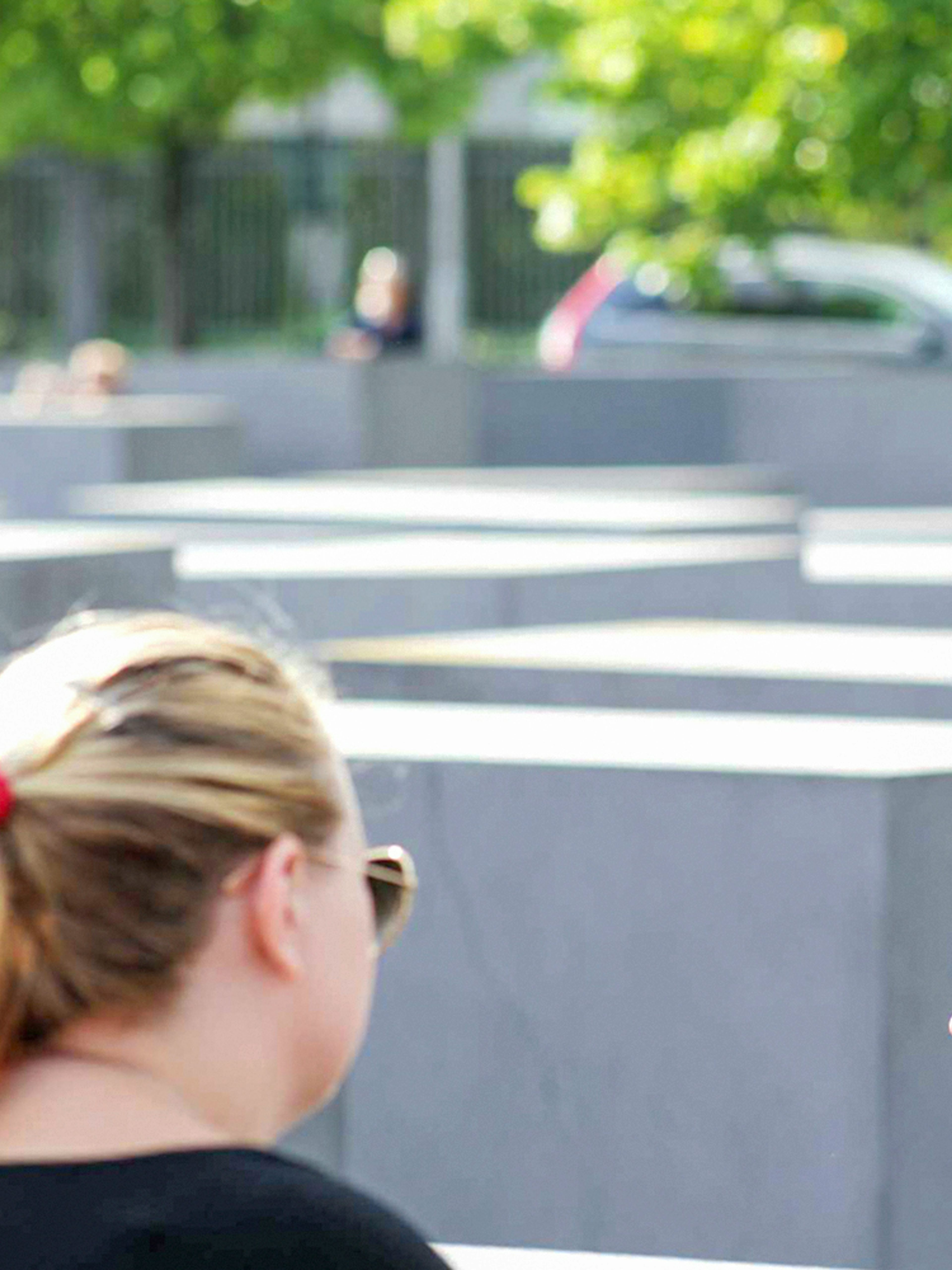 Guide explaining history during Berlin World War II walking tour.