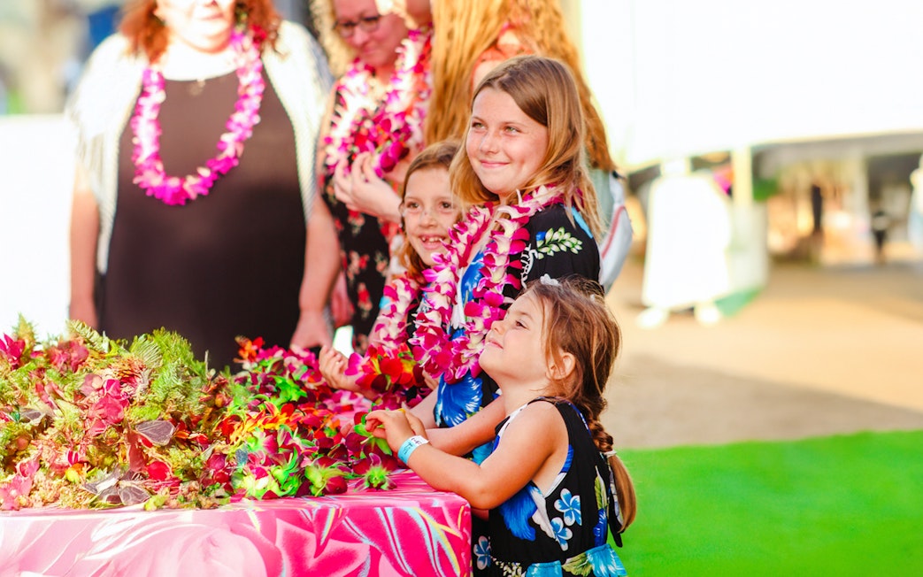 Children wearing leis at Moana Luau, Hawaii.
