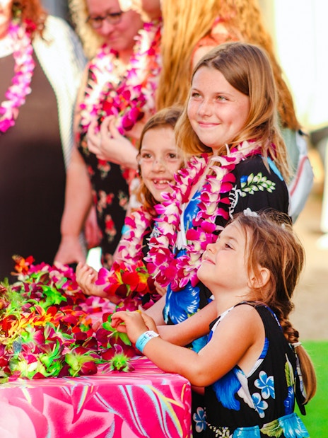 Children wearing leis at Moana Luau, Hawaii.