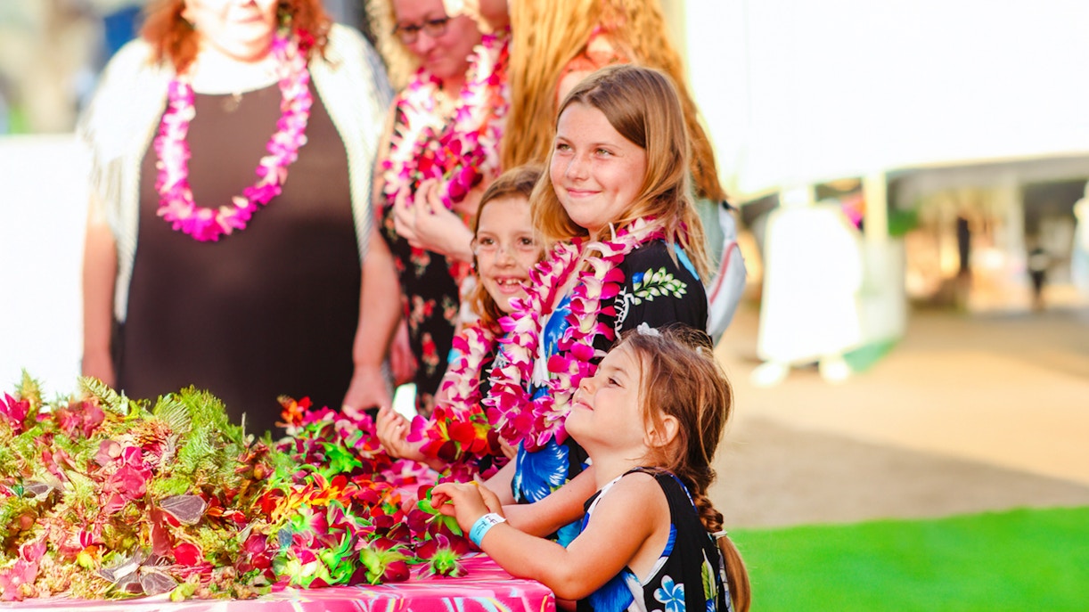 Children wearing leis at Moana Luau, Hawaii.