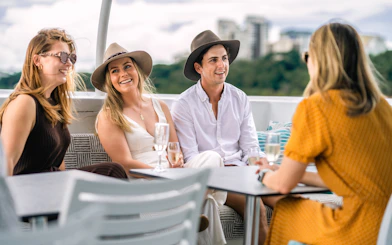 Group enjoying drinks on a Darwin Harbour lunch cruise.