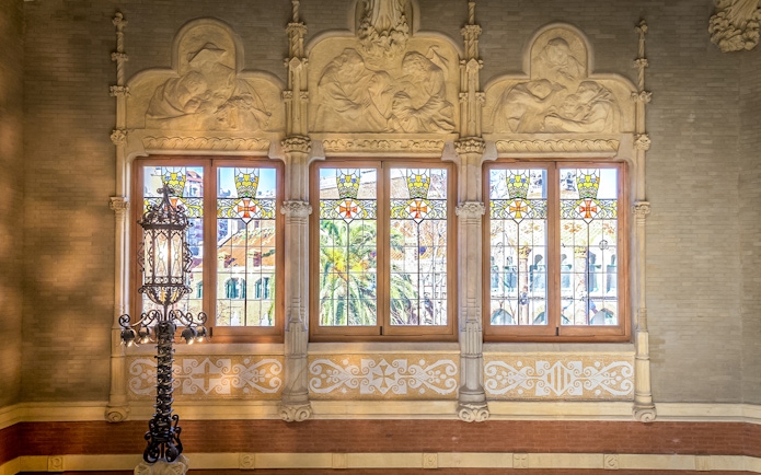 Stained glass windows and ornate carvings at Sant Pau Art Nouveau site, Barcelona.