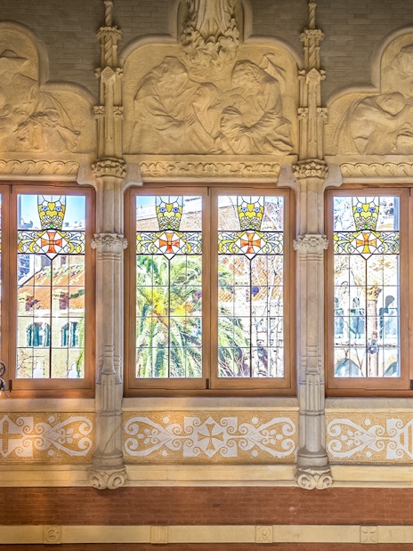 Stained glass windows and ornate carvings at Sant Pau Art Nouveau site, Barcelona.