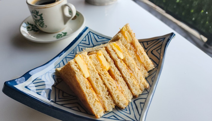 Traditional, oriental and vintage Kopitiam breakfast style Kaya toasts and black coffee