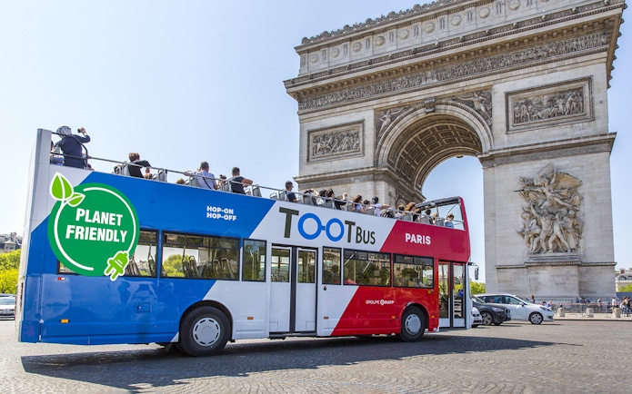 Hop on hop off Toot bus near Arc de Triomphe, Paris.