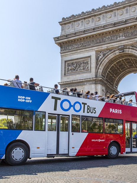 Hop on hop off Toot bus near Arc de Triomphe, Paris.