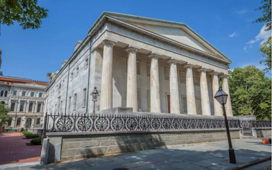Historic building with columns in Philadelphia's Old Town, part of a self-guided city exploration game.