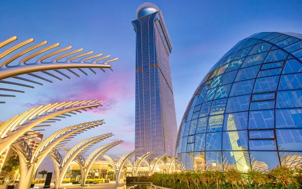 The View At The Palm observation deck and architectural structures at sunset in Dubai.