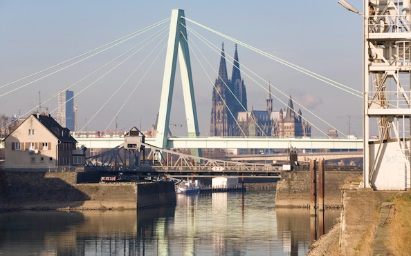 Cologne Harbour with view of the bridge and Cologne Cathedral in the background.