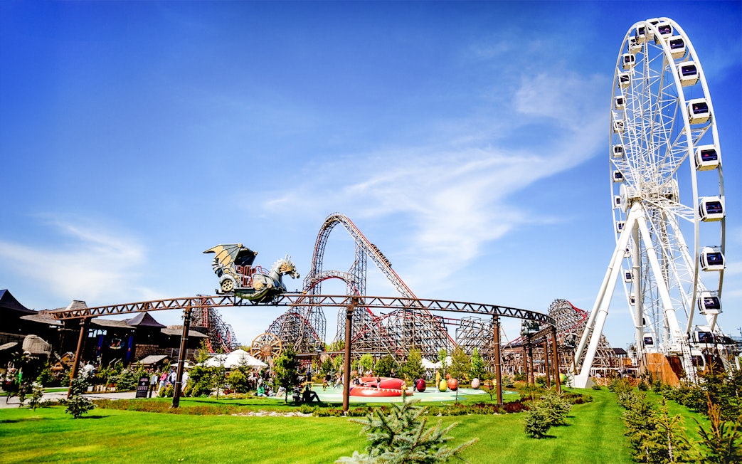 Rollercoaster and Ferris wheel at Energylandia Theme Park, Zator, near Krakow, Poland.