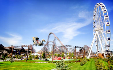 Rollercoaster and Ferris wheel at Energylandia Theme Park, Zator, near Krakow, Poland.