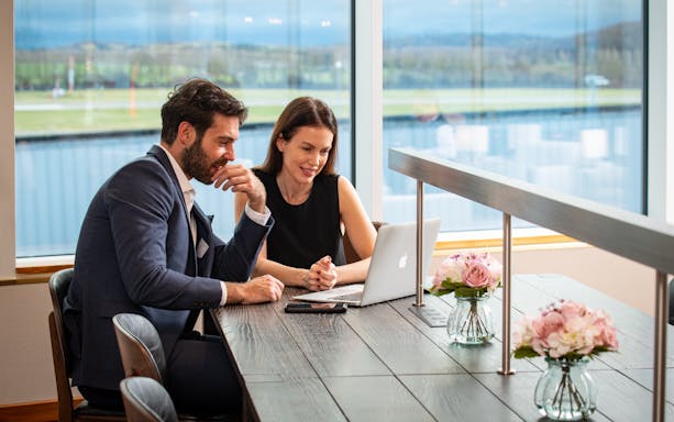 Guests working on a laptop at Turkish Airlines Lounge, Edinburgh Airport.