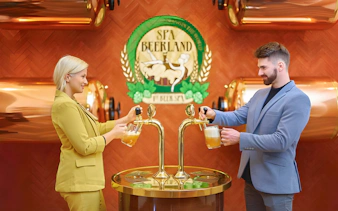 Guests pouring beer at Spa Beerland taps with logo in background.