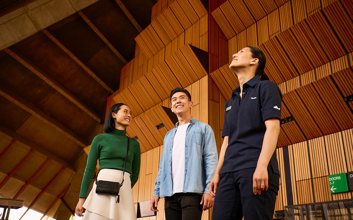 Visitors enjoying a guided tour inside the Sydney Opera House.
