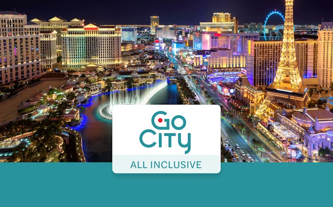Las Vegas Strip at night with fountains and Eiffel Tower replica, Go City Pass.