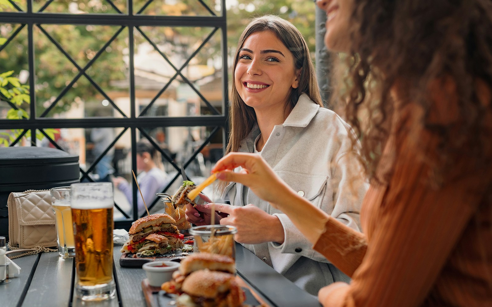 Visitors enjoying burgers and drinks