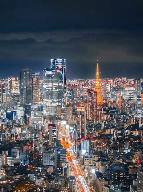 Tokyo skyline at night with Tokyo Tower from Shibuya Sky Deck.