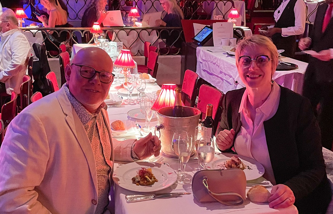 Couple enjoying champagne at Moulin Rouge