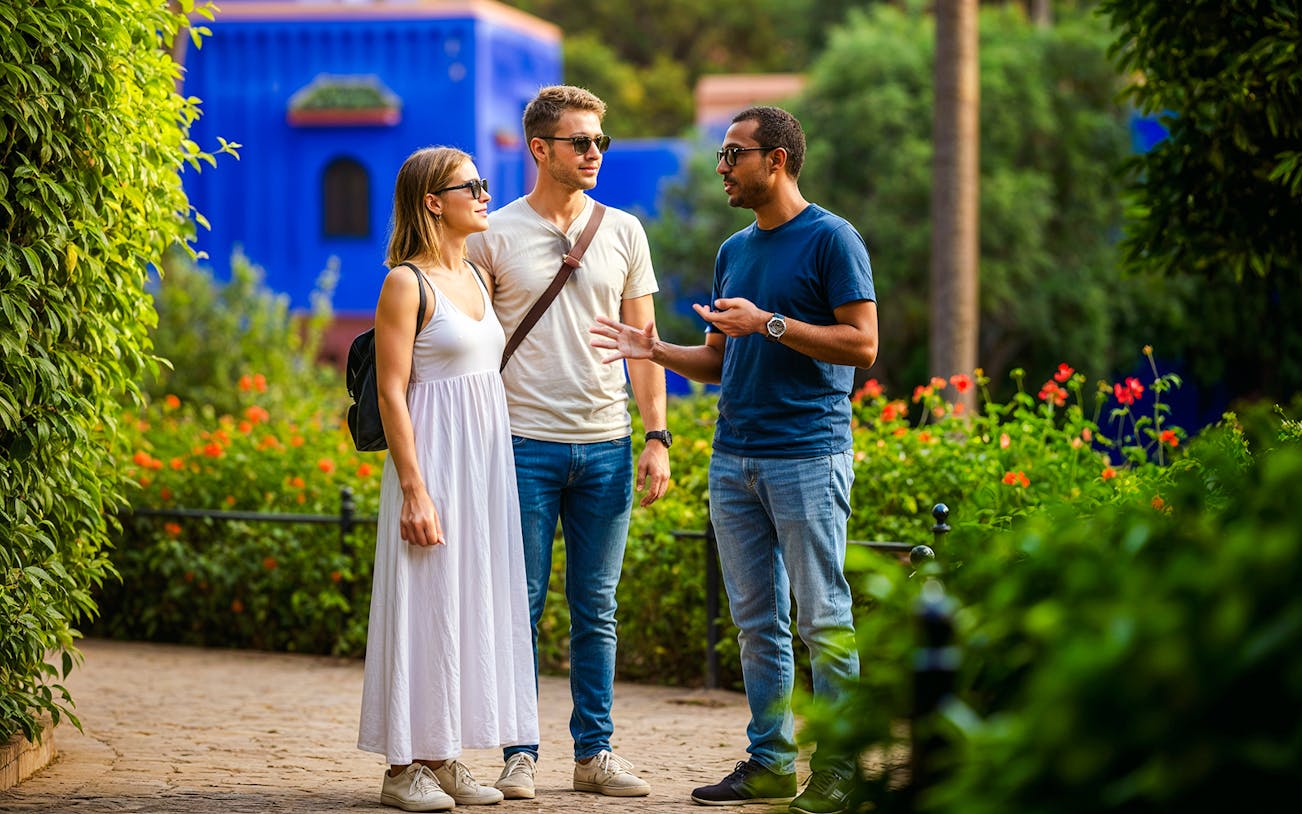 Guide explaining to tourists in Jardin Majorelle, Marrakech.