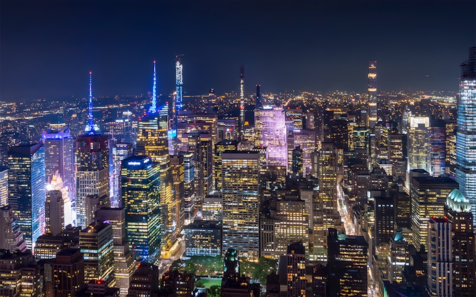 New York City skyline illuminated at night during Big Bus Night Tour.
