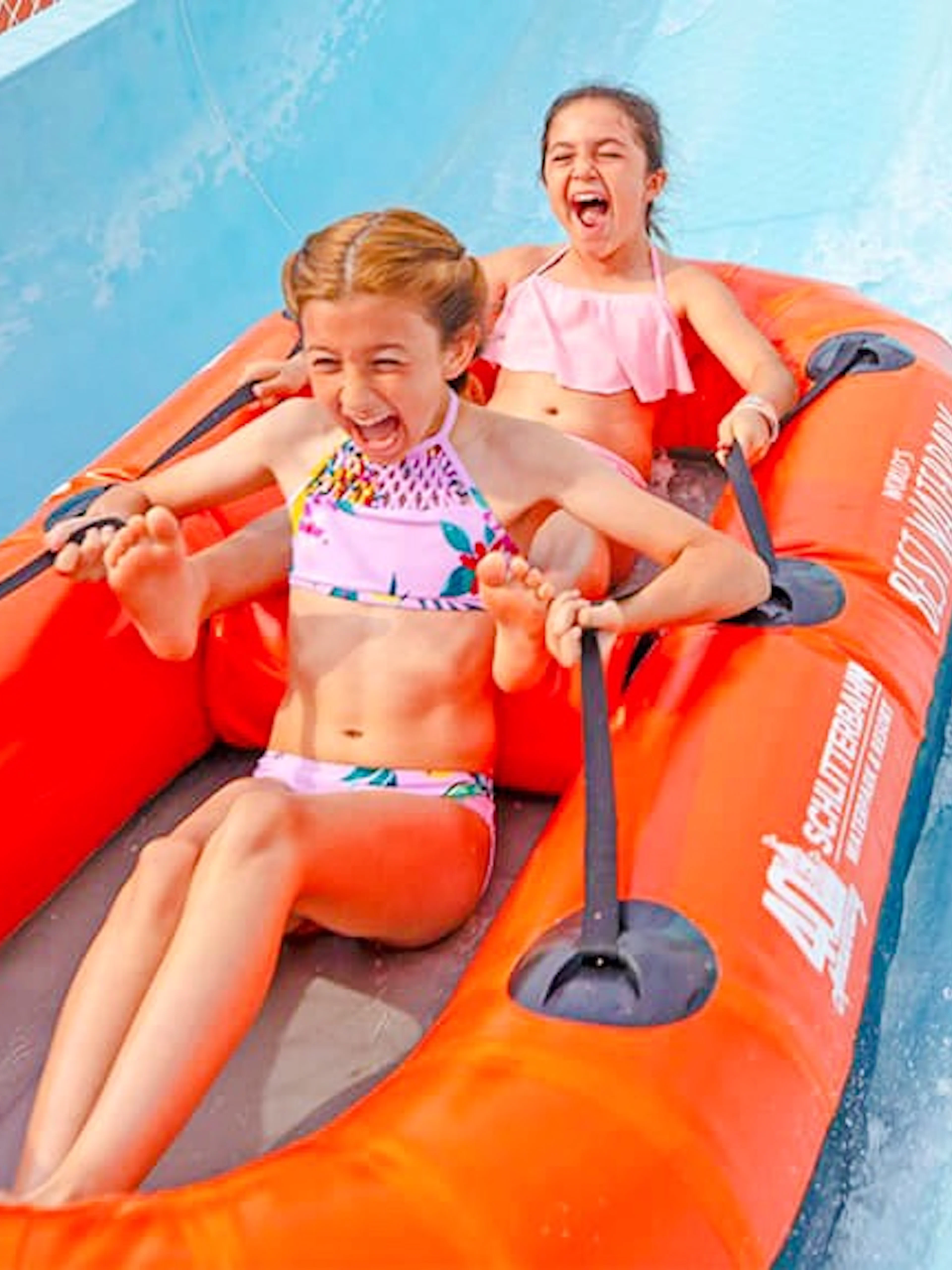 Two children enjoying the Master Blaster water ride at Schlitterbahn New Braunfels.