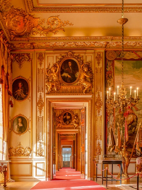 Blenheim Palace State Rooms with ornate chandeliers, portraits, and tapestries.