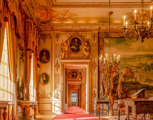 Blenheim Palace State Rooms with ornate chandeliers, portraits, and tapestries.