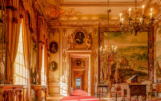 Blenheim Palace State Rooms with ornate chandeliers, portraits, and tapestries.