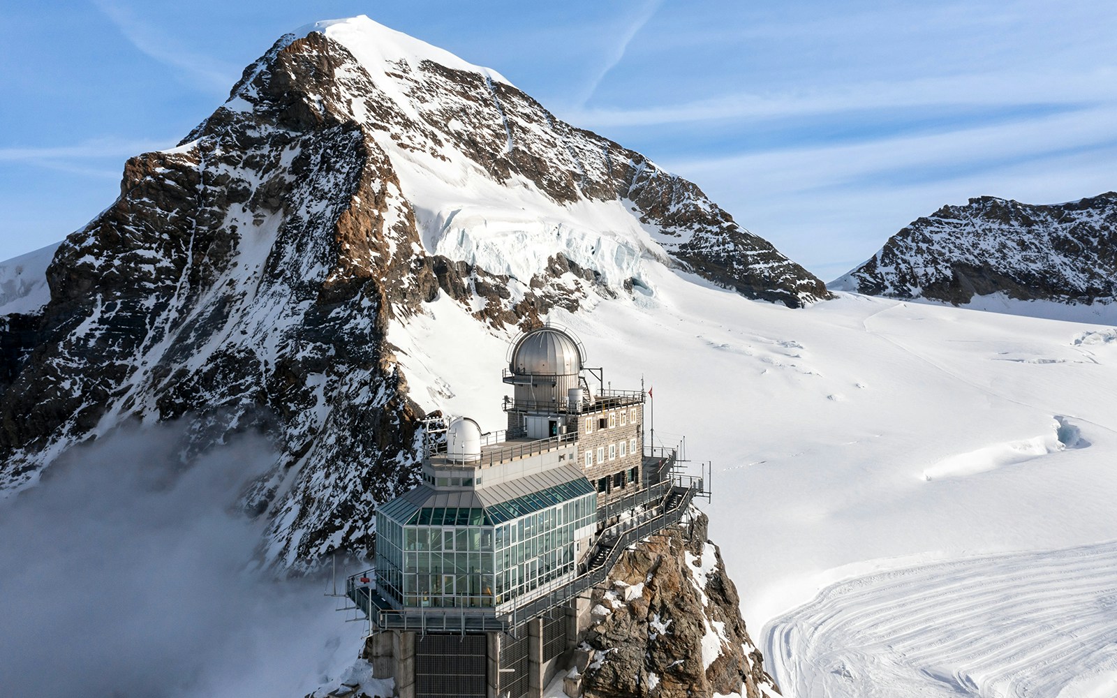 Sphinx Observatory on Jungfraujoch with snowy mountain backdrop, Switzerland.