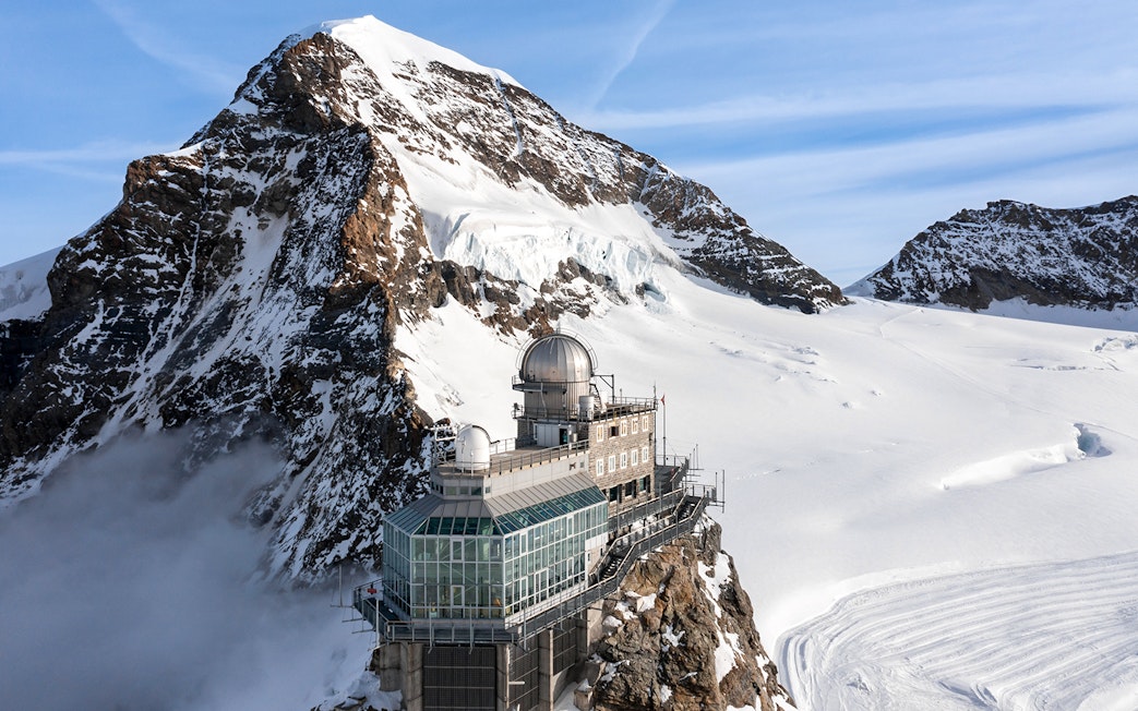 Sphinx Observatory on Jungfraujoch with snowy mountain backdrop, Switzerland.