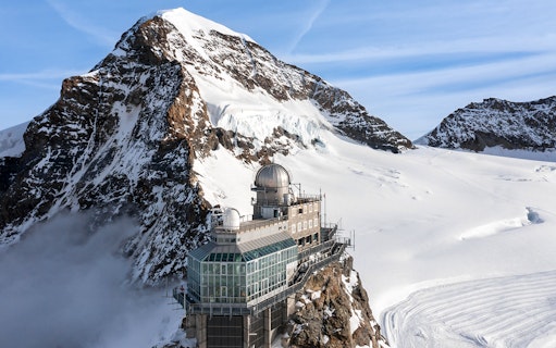 Sphinx Observatory on Jungfraujoch with snowy mountain backdrop, Switzerland.