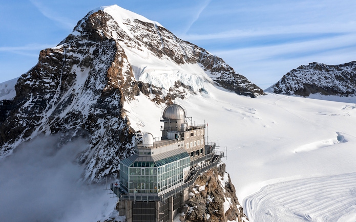 Sphinx Observatory on Jungfraujoch with snowy mountain backdrop, Switzerland.