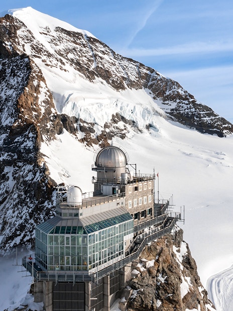 Sphinx Observatory on Jungfraujoch with snowy mountain backdrop, Switzerland.