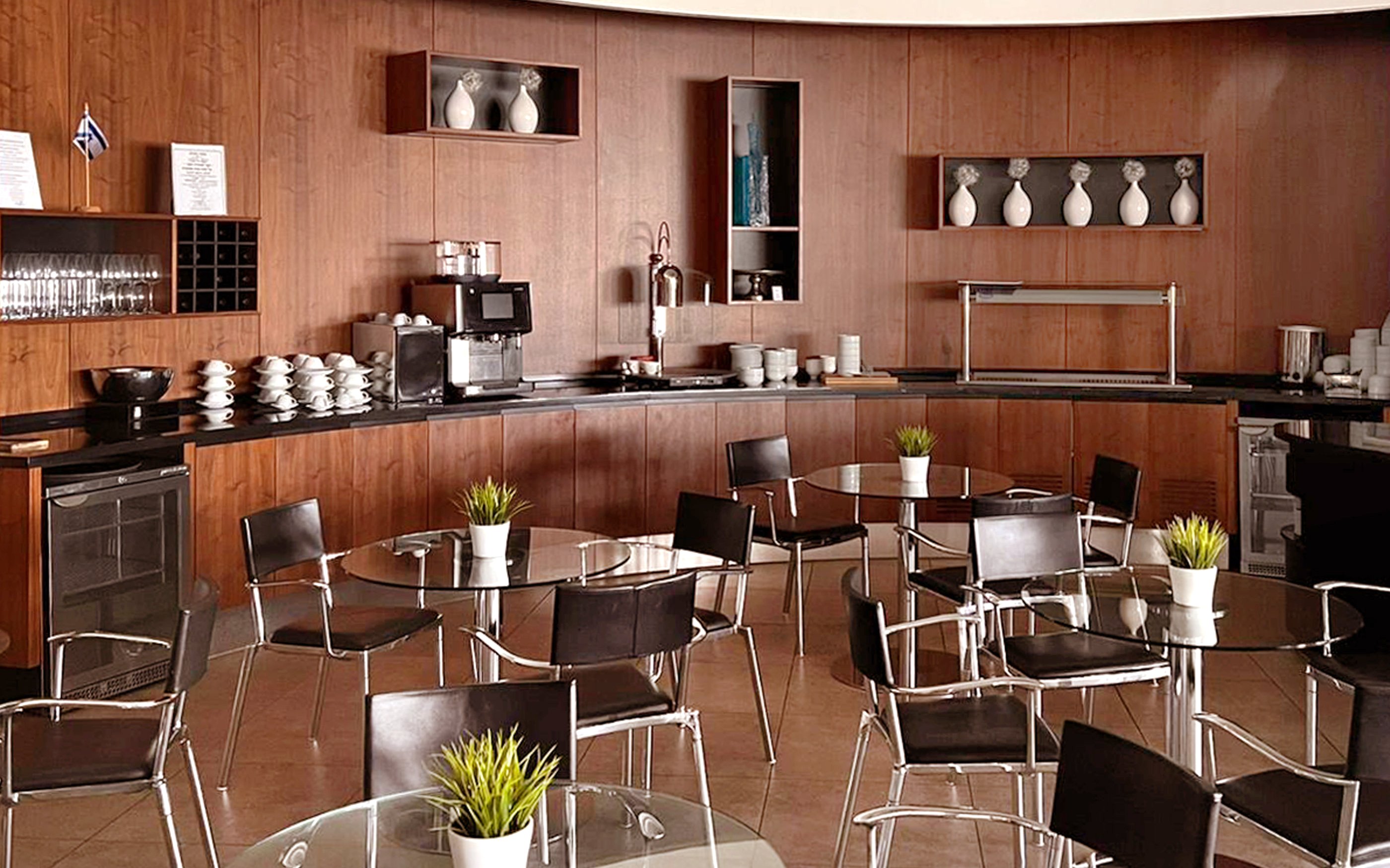 Blush Lounge seating area with tables and chairs, Terminal 4, London Heathrow Airport.