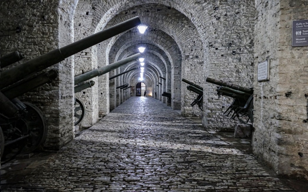 Cannons line the stone corridor inside Gjirokaster Castle, Albania.