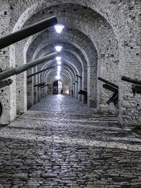 Cannons line the stone corridor inside Gjirokaster Castle, Albania.