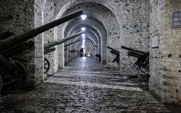 Cannons line the stone corridor inside Gjirokaster Castle, Albania.