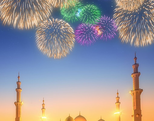 Fireworks over Sheikh Zayed Grand Mosque at dusk, Abu Dhabi.