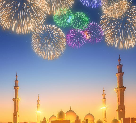Fireworks over Sheikh Zayed Grand Mosque at dusk, Abu Dhabi.