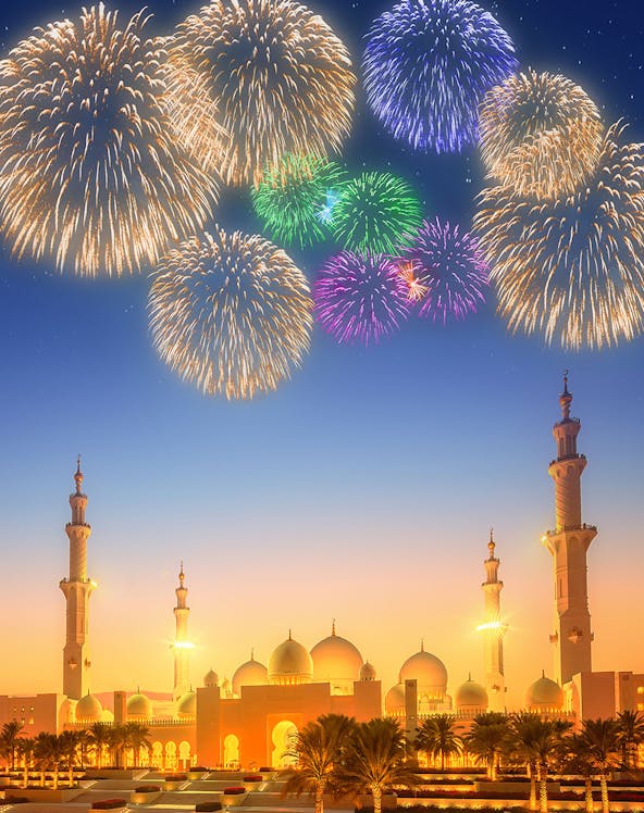 Fireworks over Sheikh Zayed Grand Mosque at dusk, Abu Dhabi.