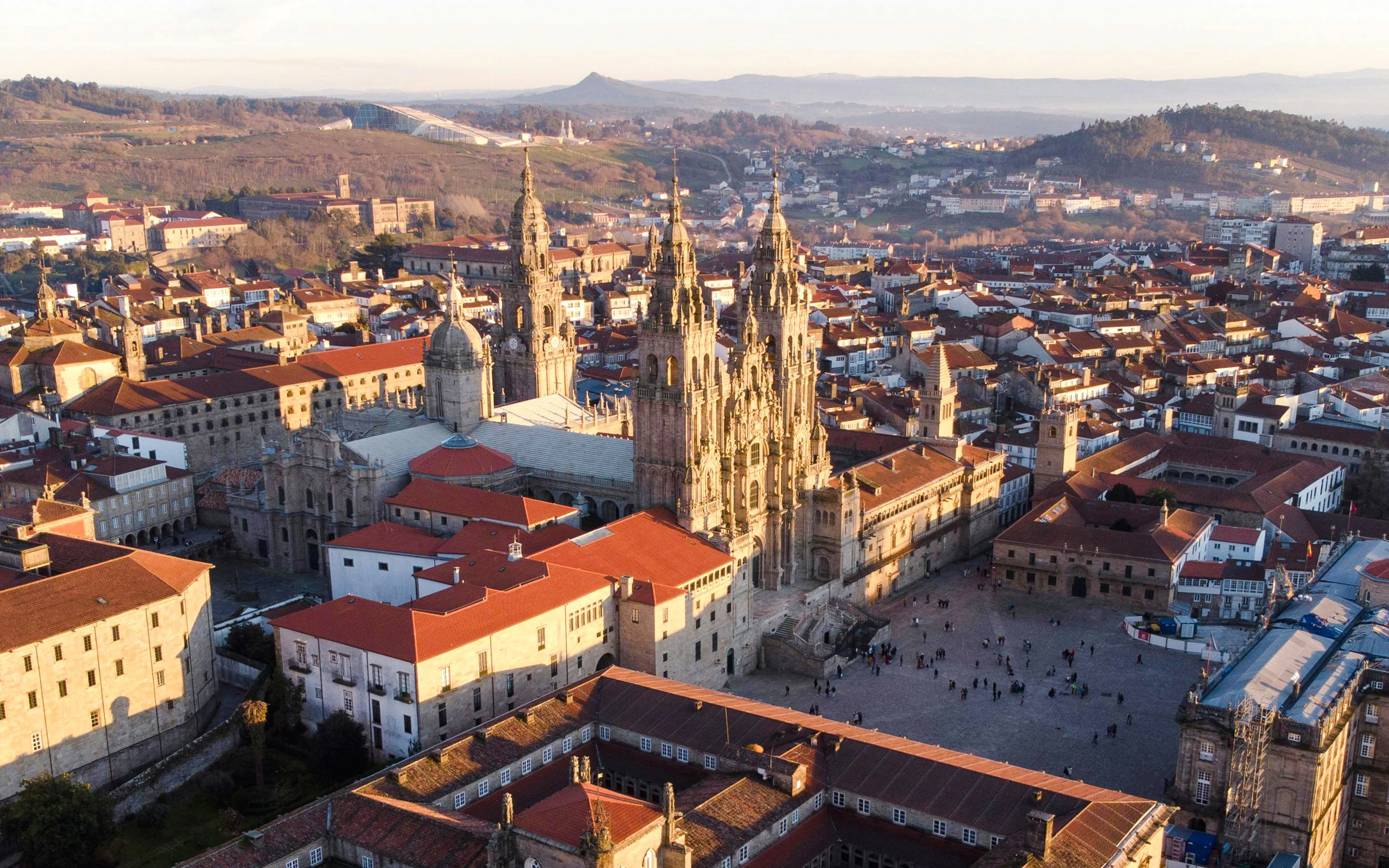 Aerial view of the Cathedral of Santiago de Compostela, Spain, surrounded by historic buildings.