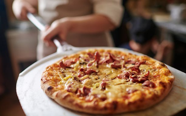 Pizza being served during a food and wine tasting in Rome, Italy.