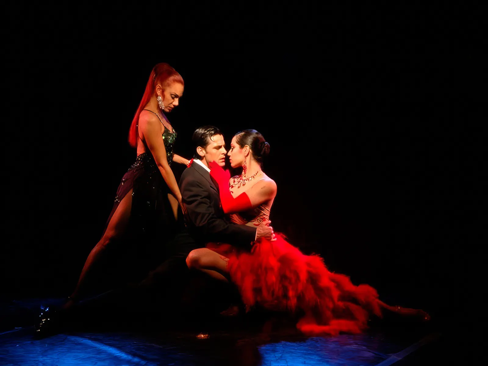 Tango dancers performing at Rojo Tango Show in Buenos Aires.