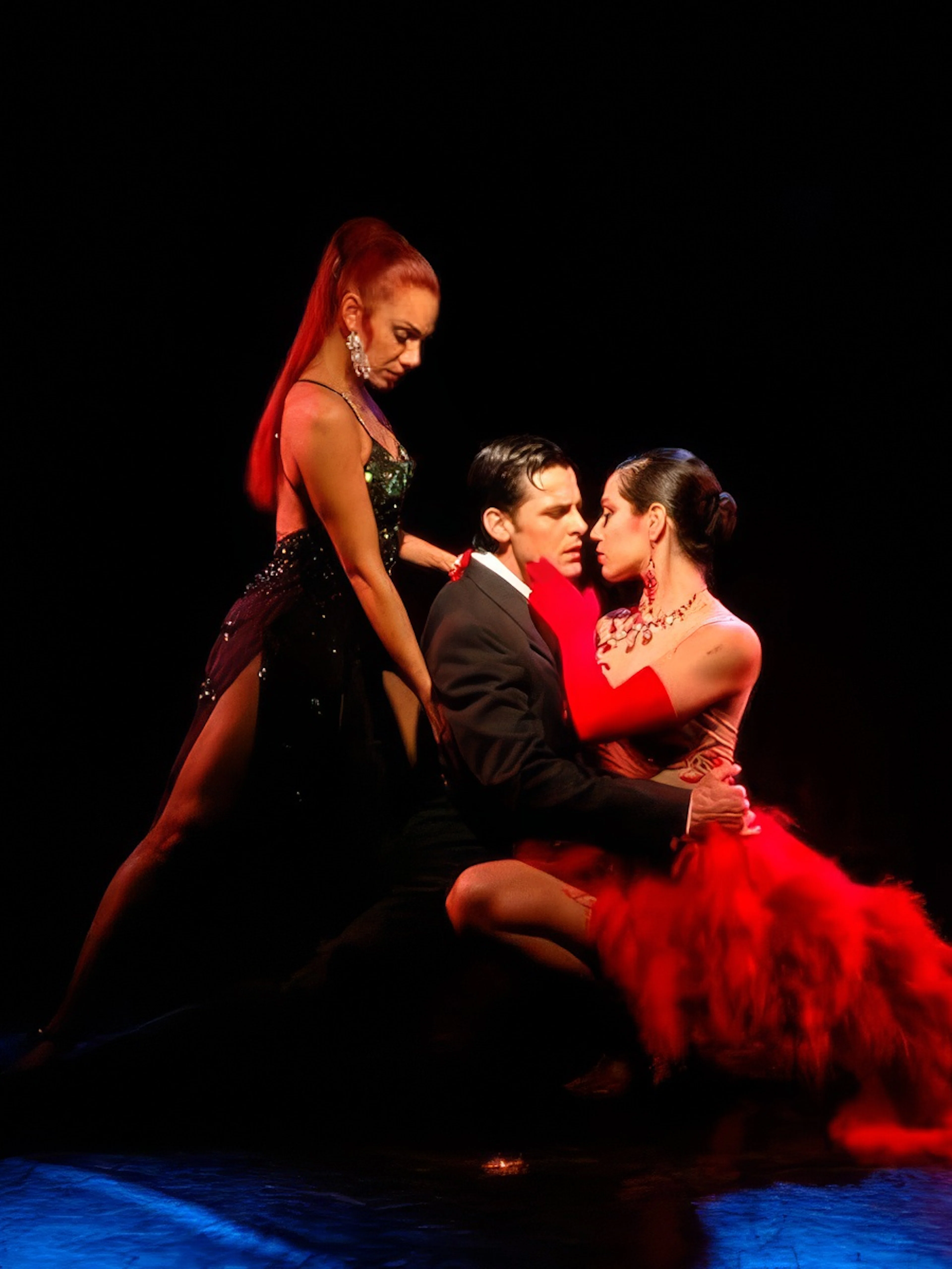 Tango dancers performing at Rojo Tango Show in Buenos Aires.