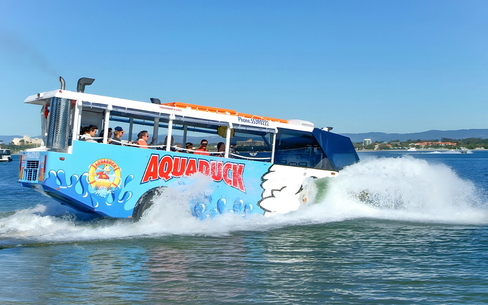 Aquaduck amphibious vehicle cruising on a river during a city tour.