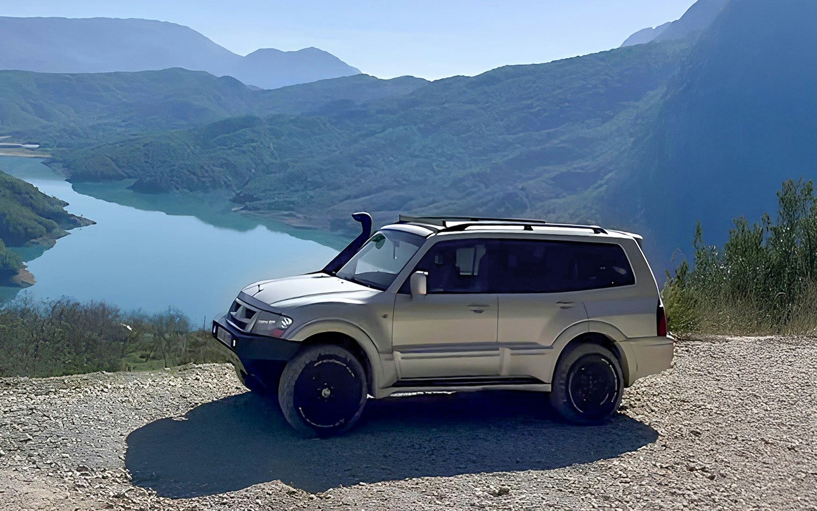 4x4 vehicle overlooking Bovilla Lake during offroad tour from Tirana.