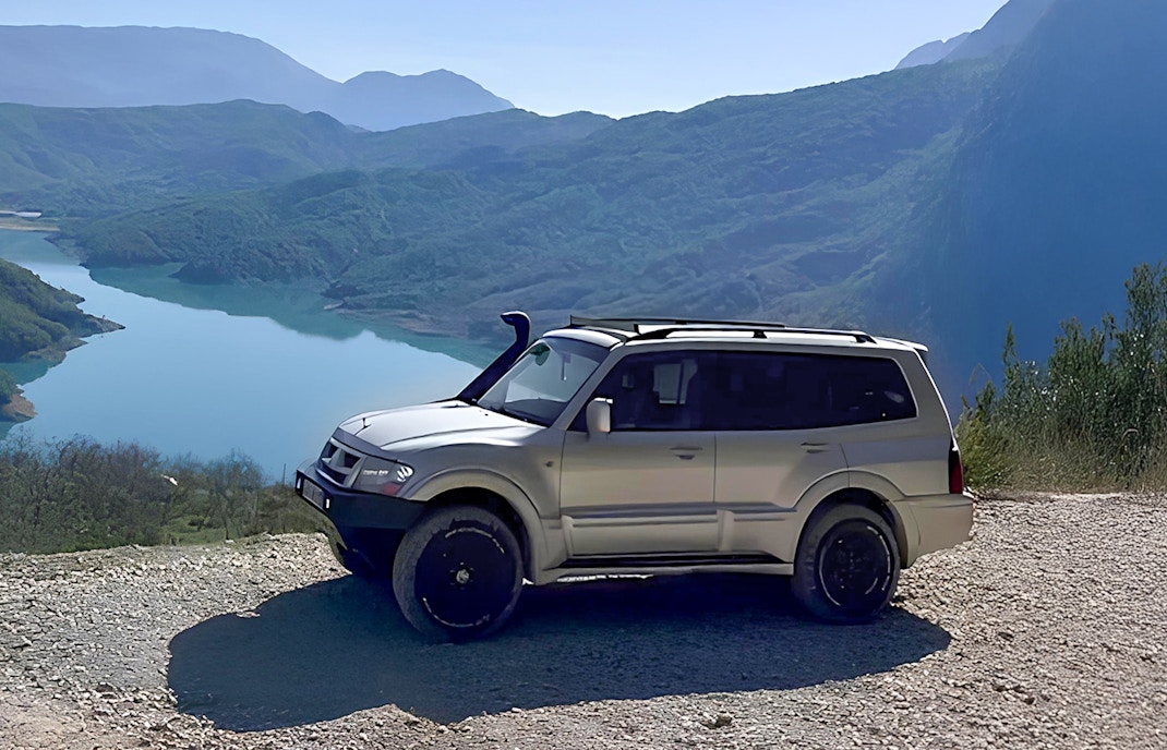 4x4 vehicle overlooking Bovilla Lake during offroad tour from Tirana.