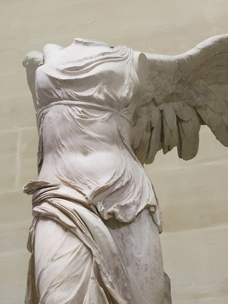 Winged Victory of Samothrace statue at the Louvre Museum, Paris.