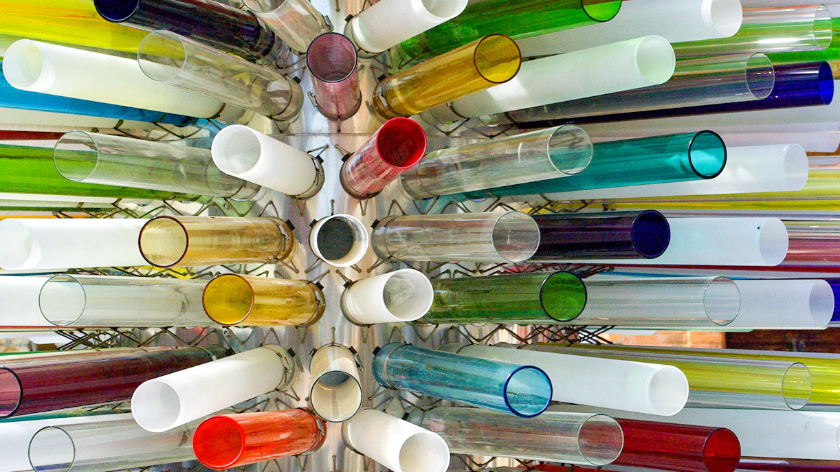 Colorful Murano glass tubes arranged in a radial pattern.