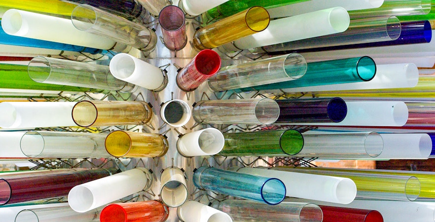Murano glass artist crafting intricate glass piece in Venice lagoon workshop.